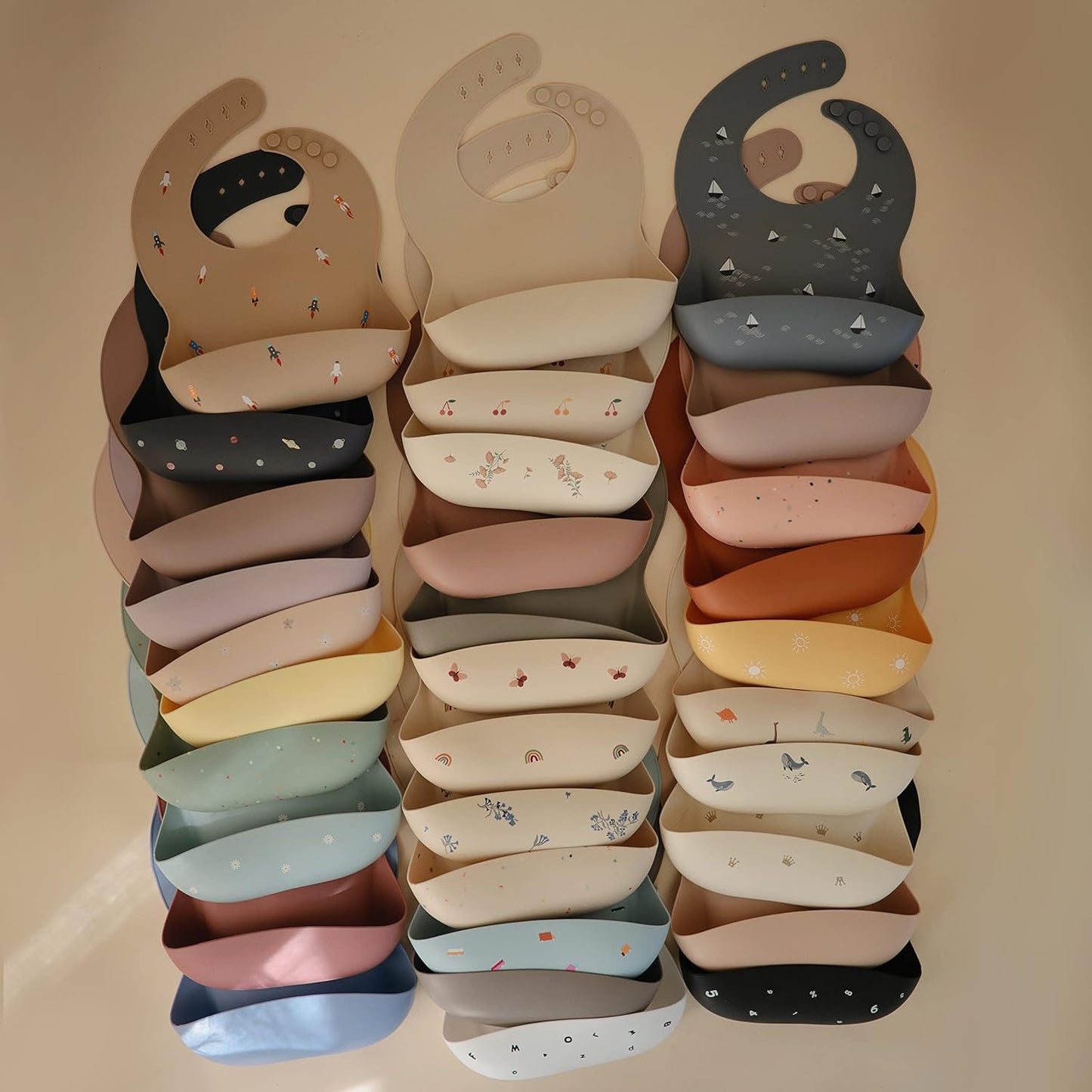 mushie Silicone Baby Bib | Adjustable Fit Waterproof Bibs (Bows)