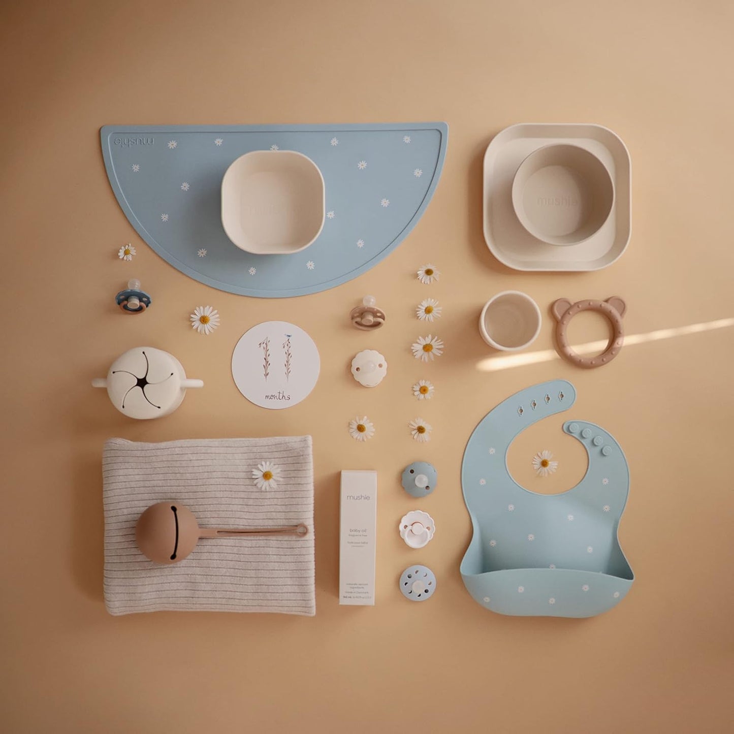 mushie Silicone Baby Bib | Adjustable Fit Waterproof Bibs (White Daisy)